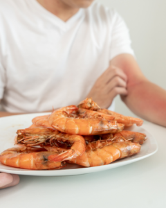 Close-up of shrimp on a plate — a common food allergen that can cause severe allergic reactions.
